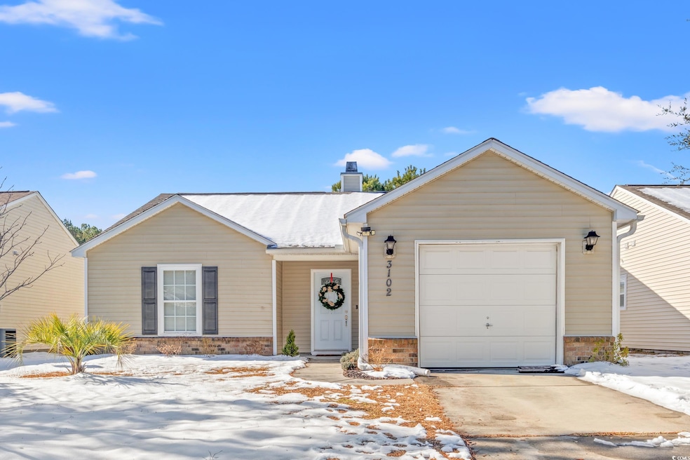 Ranch-style home featuring a garage