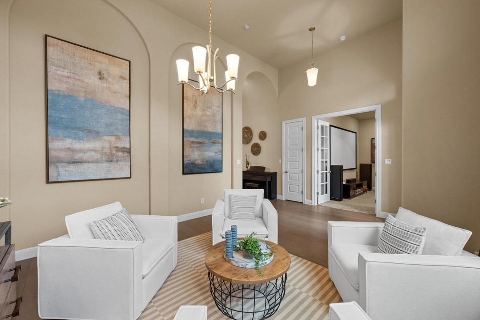 Living room featuring light wood-style floors, a 