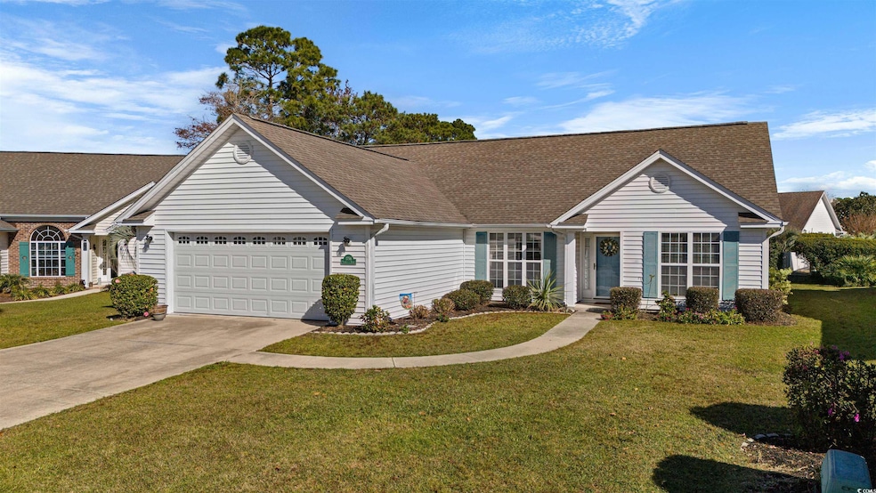 Ranch-style house with a front lawn and a garage