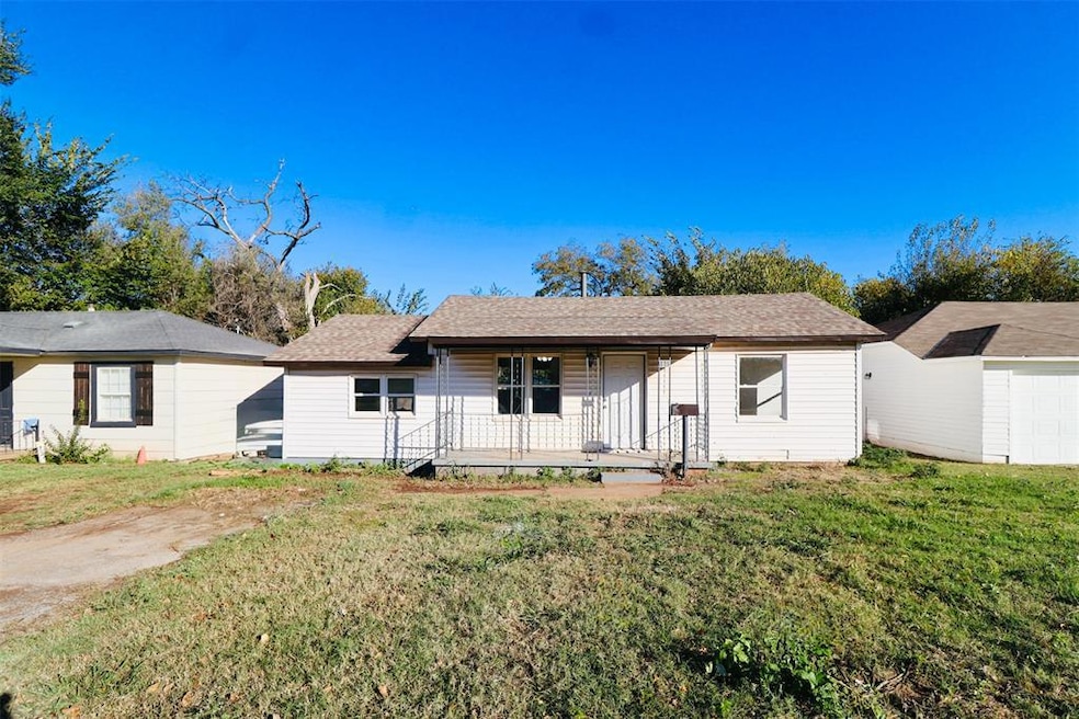 Single story home with a front lawn and a shingled roof