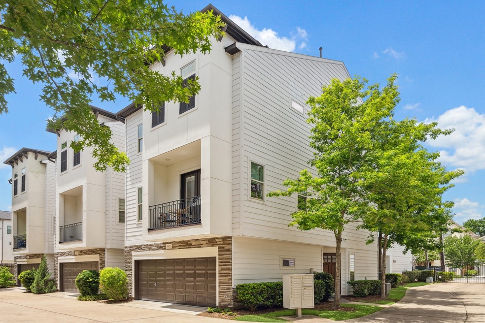 This traditional three-story townhome boasts a cri