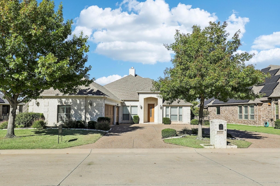 View of front of house featuring a garage and a fr