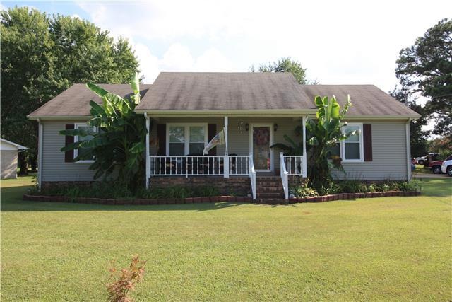 Front View of Home - Nicely landscaped with covered front porch for relaxing.