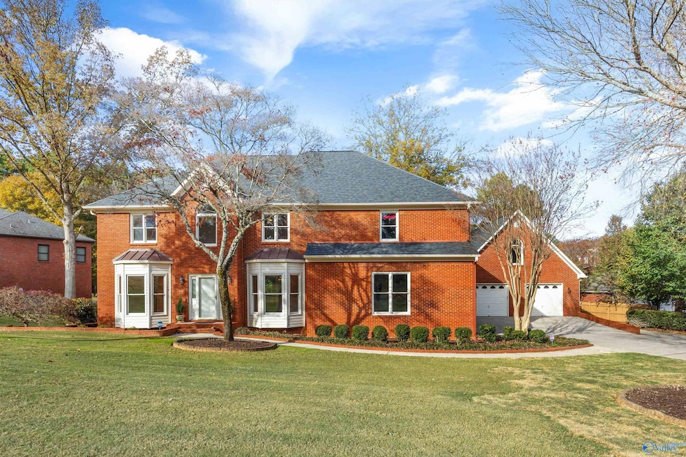 Beautifully updated brick residence featuring 4 bedrooms, 4 baths, and a versatile bonus room