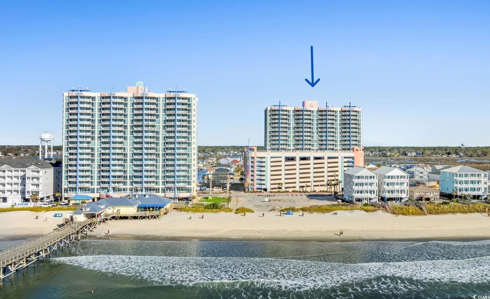Sister Towers amidst a row of raised beach houses 