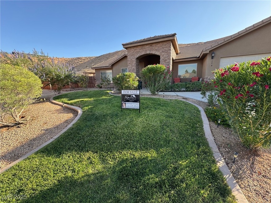 View of front of home featuring a front lawn, stuc