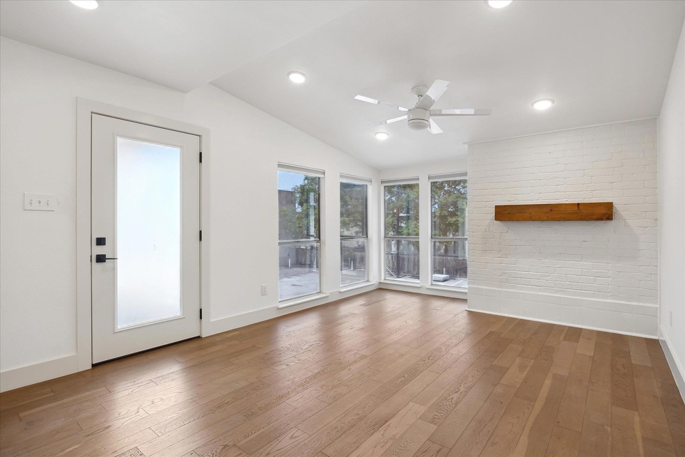 Unfurnished living room with hardwood / wood-styl