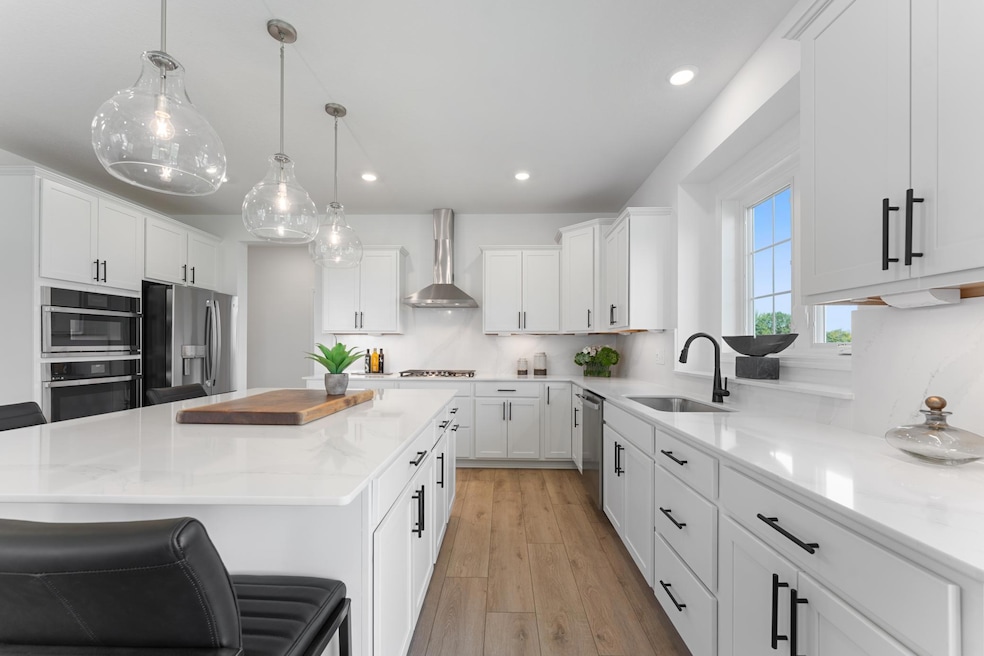 (Photo of a similar home, actual homes finished will vary) Welcome to the Snelling! This spacious gourmet kitchen features a large center island, quartz countertops, LVP floors, stainless steel appliances, and more.