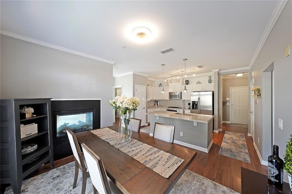 Dining space with crown molding, baseboards, visib
