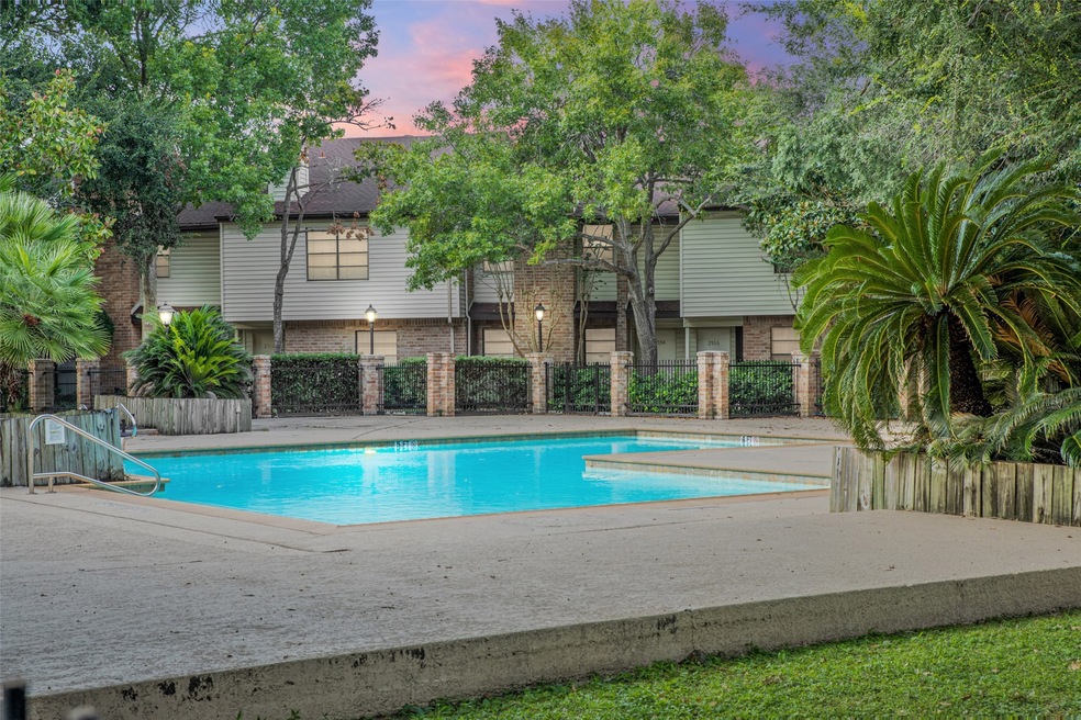 The community pool is right behind the house!