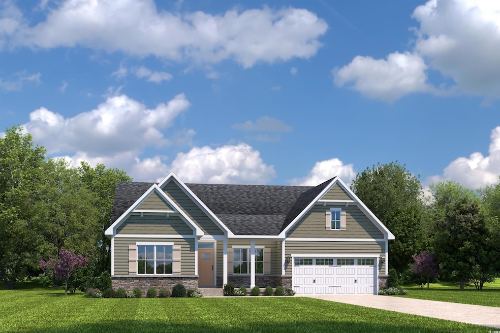 Craftsman-style house with a garage and a front ya