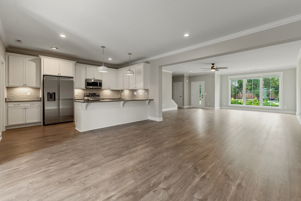 Open floor plan, floor to ceiling windows, luxury finishes, & appliances included!