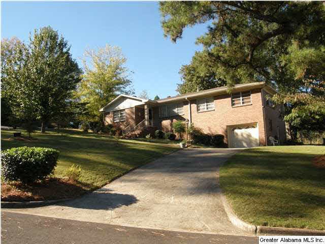 Very large corner lot with lots of trees.