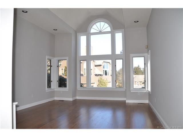 Formal living room with fantastic windows, new woo