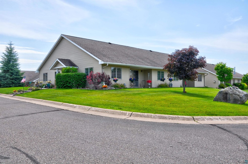 Ranch-style house with a front lawn
