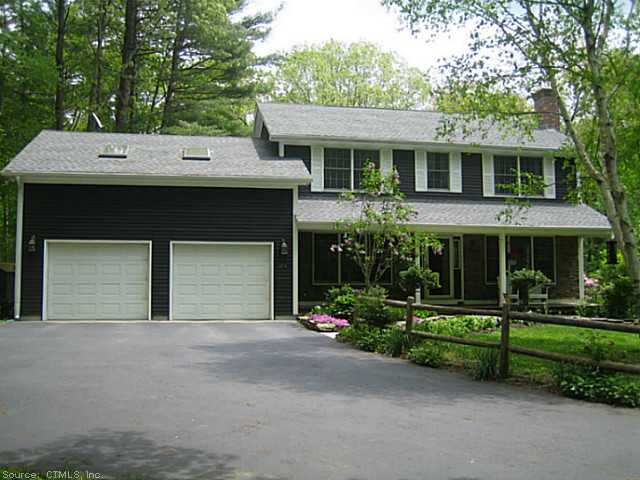 Exterior Front. Nestled with lots of Privacy!