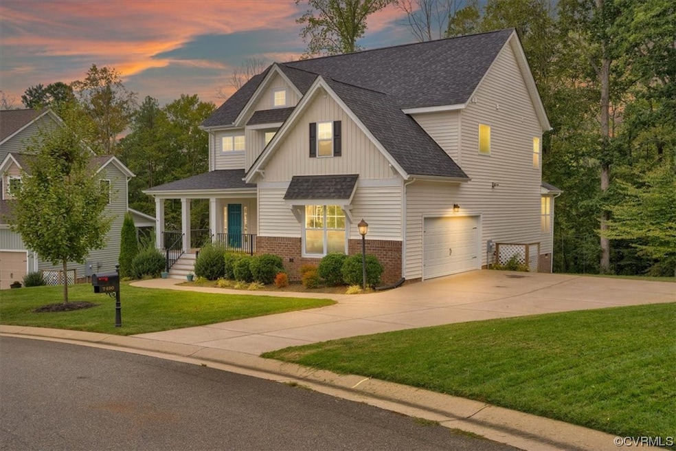 View of front of property with a lawn and a garage