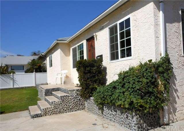 Front elevation / Front door / Window on right is 
