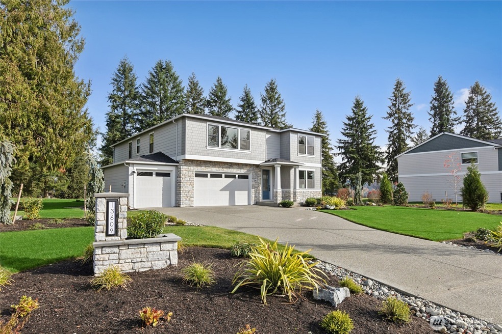 Actual home shown. Custom designed Address monument is lit at night. Photos are for representational purposes only.  Colors and options may vary.