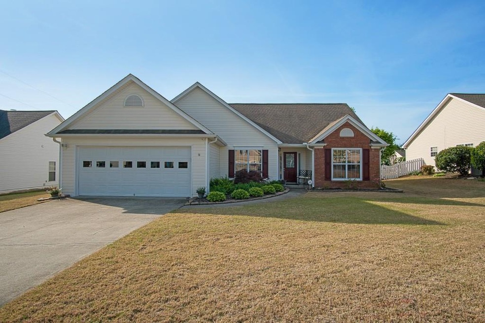 Welcome home to this charming ranch in a quiet and