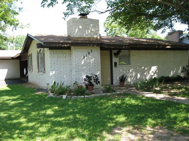 Exterior Front with carport on left