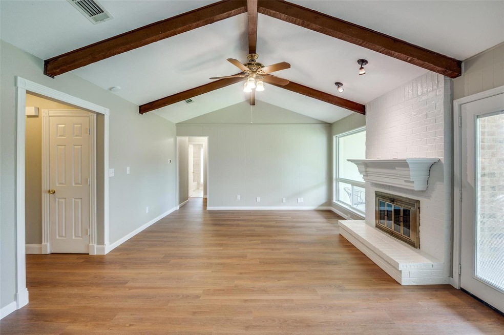 Welcome to this gorgeous home featuring lots of updates including this beautiful living room with luxury LVP and raised sunken floor