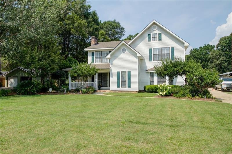 Street view of this home and beautifully landscape