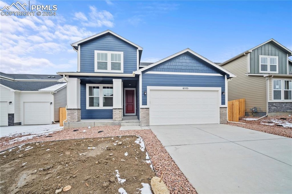 View of front of home with a garage