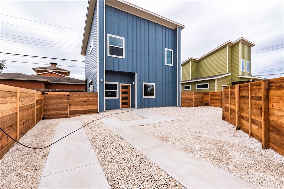 Rear view of property featuring board and batten 