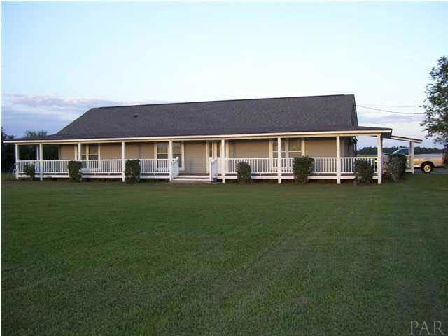 Exterior view with 3/4 wrap around porch.
