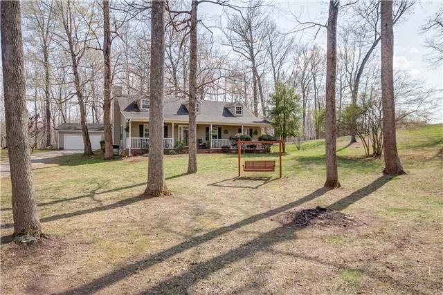 Immaculate home with open floor plan nestled in the trees on a corner lot.