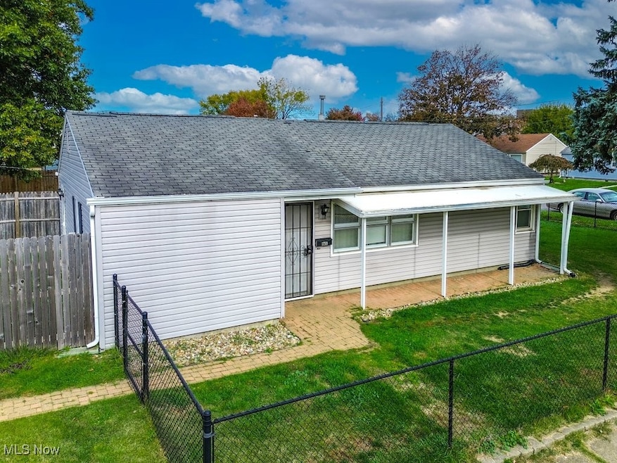 View of front facade featuring roof with shingles