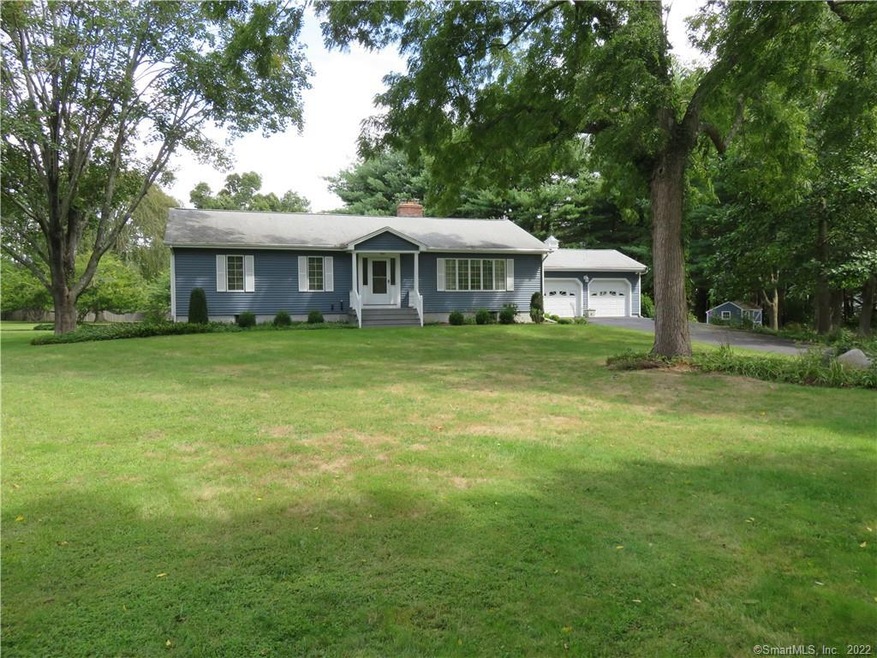 Level one acre lot with lovely landscaping and lig