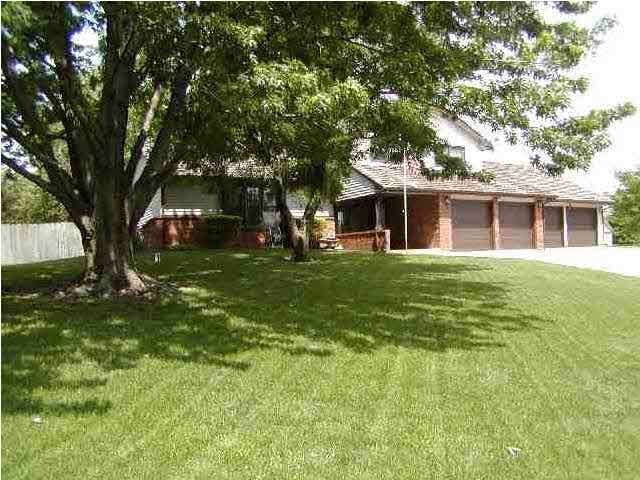 Nice big yard with great curb appeal with four car