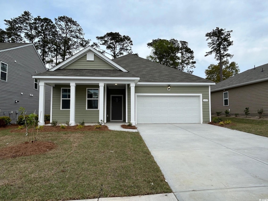 View of front of home with driveway, an attached g