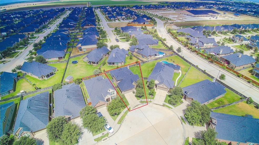 Amazing aerial shot of this gorgeous home situated on a quiet cul-de-sac street in the sought after community of Firethorne! Look how accessible the park is! Lush landscaping, well manicured front lawn, and a wonderful back patio perfect to set up an outdoor sitting area!