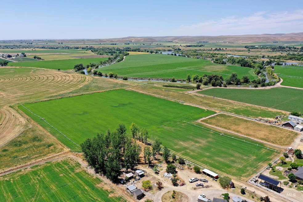 Aerial view of sparsely populated area featuring large plots for crops