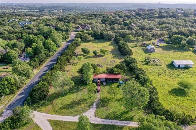 1.55 acres w/light restrictions, horses allowed, only 20 minutes to downtown Austin. Horse barn w/tack room & paddocks, water tank included.