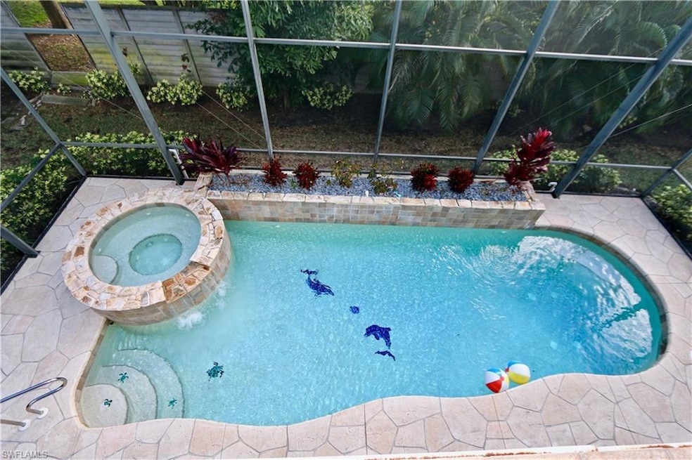 View of front of property featuring a lanai, a garage, and a front yard