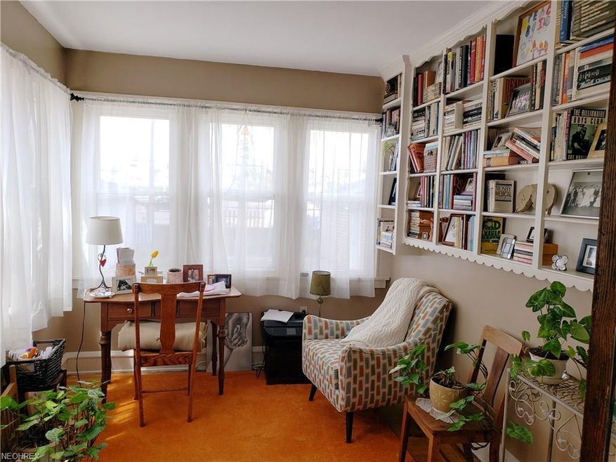 1st Floor Library/Sunroom with windows on both corner walls of the home