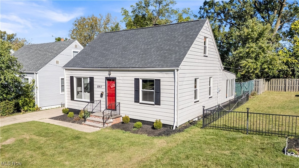 New england style home featuring roof with shingles
