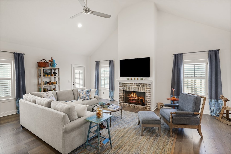 Welcoming living area with beautiful brick firepla