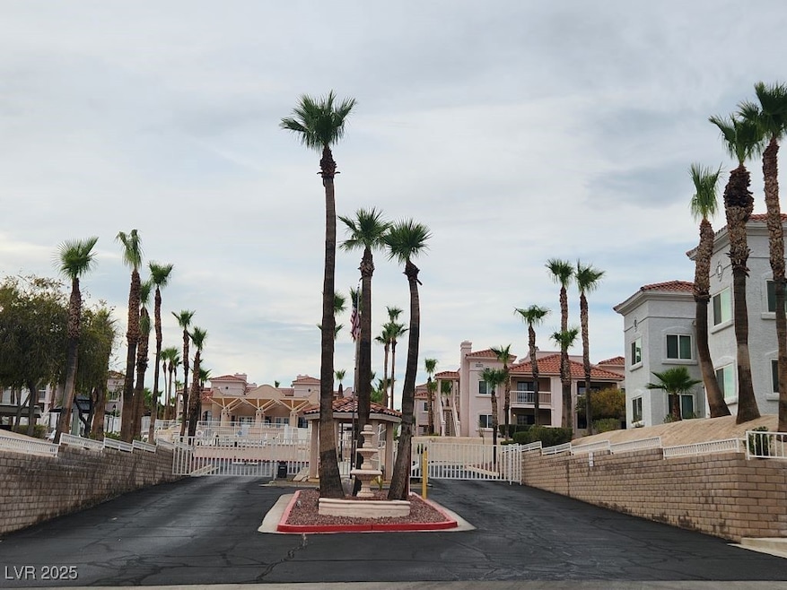 View of road with a gate, a gated entry, and a res