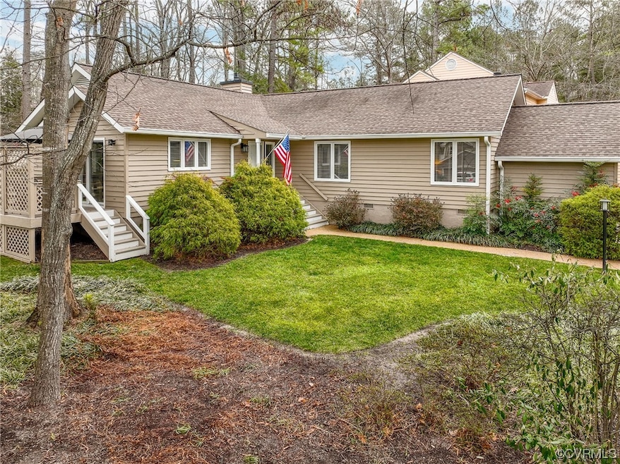 Ranch-style home with a front lawn