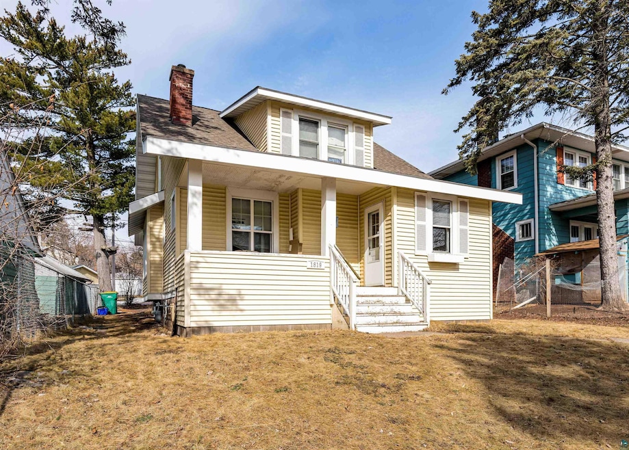Bungalow-style house featuring a shingled roof, a 