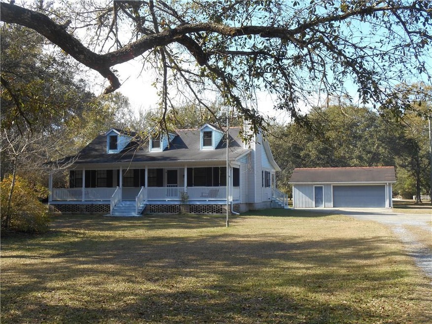 Spacious Front Porch has two swings, one at each e