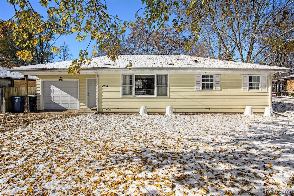 Single story home featuring an attached garage