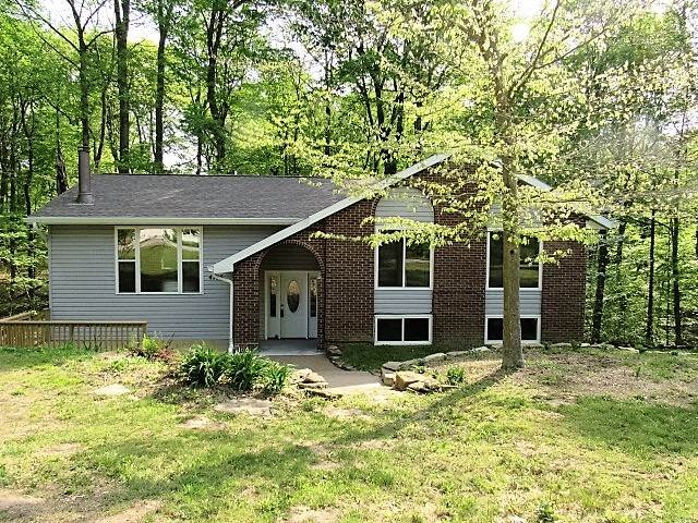 Spacious lot with home well off quiet street.