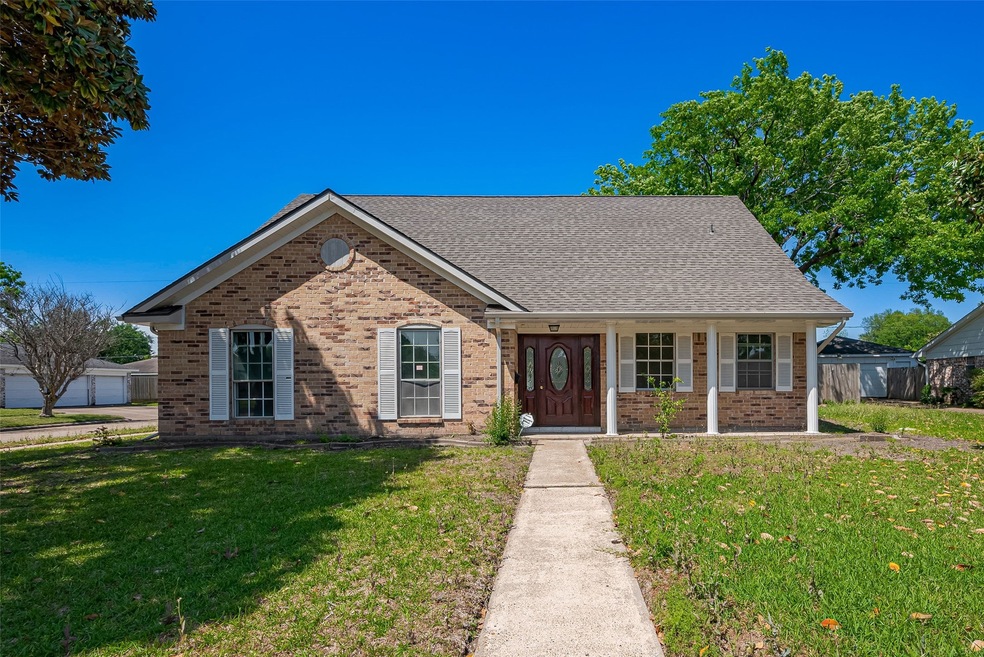 Charming brick home with a welcoming front porch,