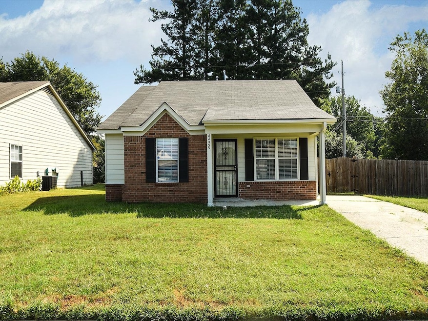 Bungalow-style house featuring brick siding, centr
